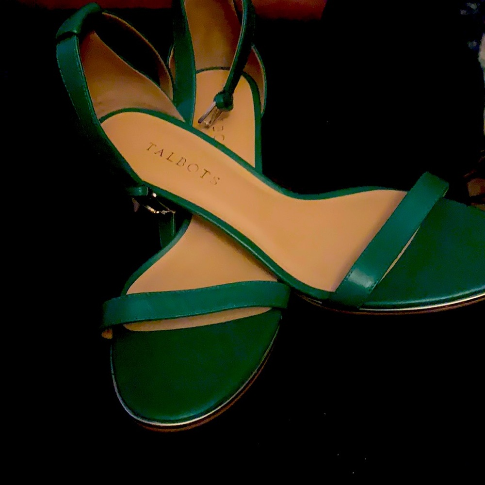 A pair of green wooden high heels . Never worn.